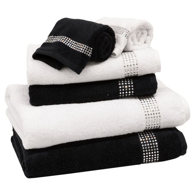 Three stacked towels in black and white featuring rhinestone embellishments on the stripes made of cotton with a plush texture.