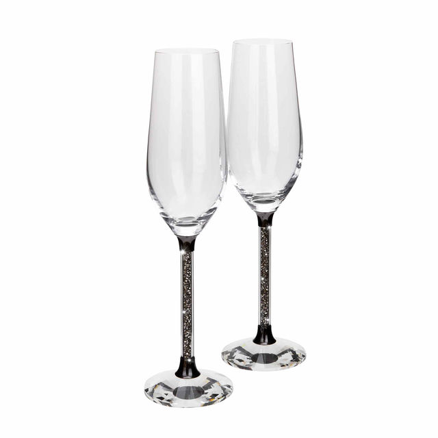 Clear crystal toasting flute with a black base and a glittering silver-filled stem measures 10"x3"x3". Clear crystal toasting flute with a black base and a glittering silver-filled stem measures 10"x3"x3".