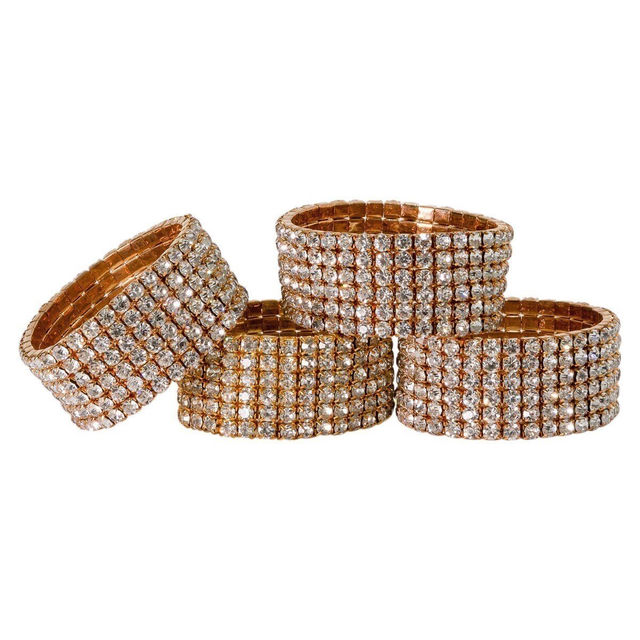 Set of 4 gold elastic napkin rings adorned with clear glass rhinestones in a grid pattern.
