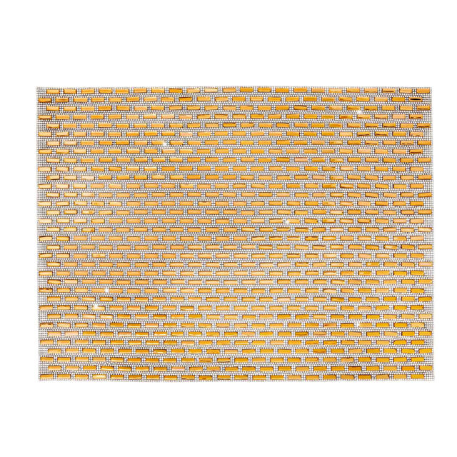 Silver placemat with a subway tile design adorned with glass stones featuring a felt backing and a textured surface.