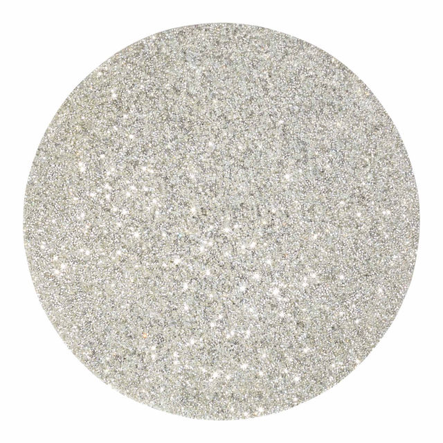Round silver placemat with a textured surface adorned with vibrant rhinestones reflecting light for a sparkling effect.