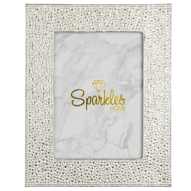 Silver&#x20;picture&#x20;frame&#x20;adorned&#x20;with&#x20;glass&#x20;rhinestones&#x20;featuring&#x20;a&#x20;marble-patterned&#x20;background&#x20;and&#x20;a&#x20;gold&#x20;logo.