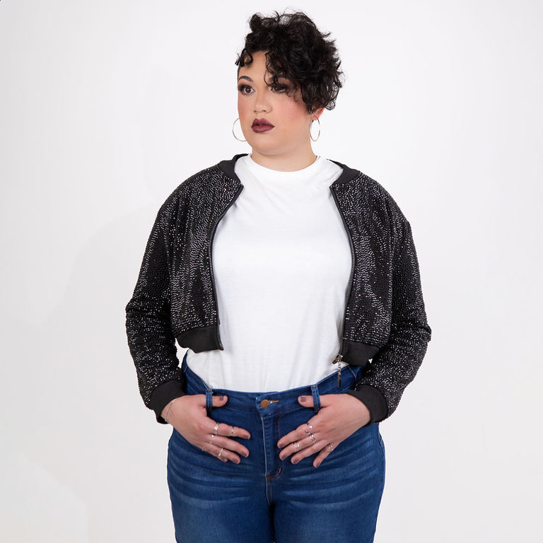 Black rhinestone cropped bomber jacket modeled with a white shirt and blue jeans