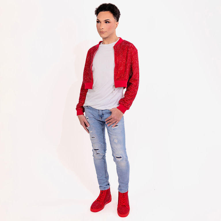 Model wearing a red rhinestone cropped bomber jacket over a white T-shirt with jeans and red boots