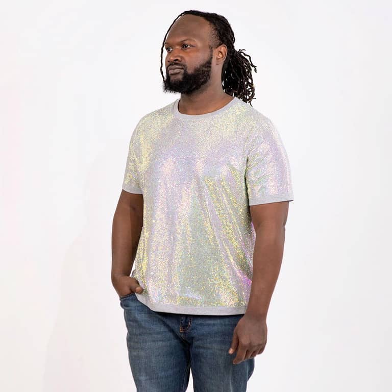 Man wearing a short-sleeve iridescent rhinestone T-shirt with a straight fit