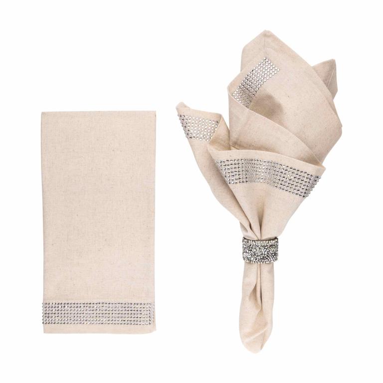 Two taupe napkins made of linen and cotton with crystal rhinestone bands along the edges one folded elegantly with a rhinestone ring.