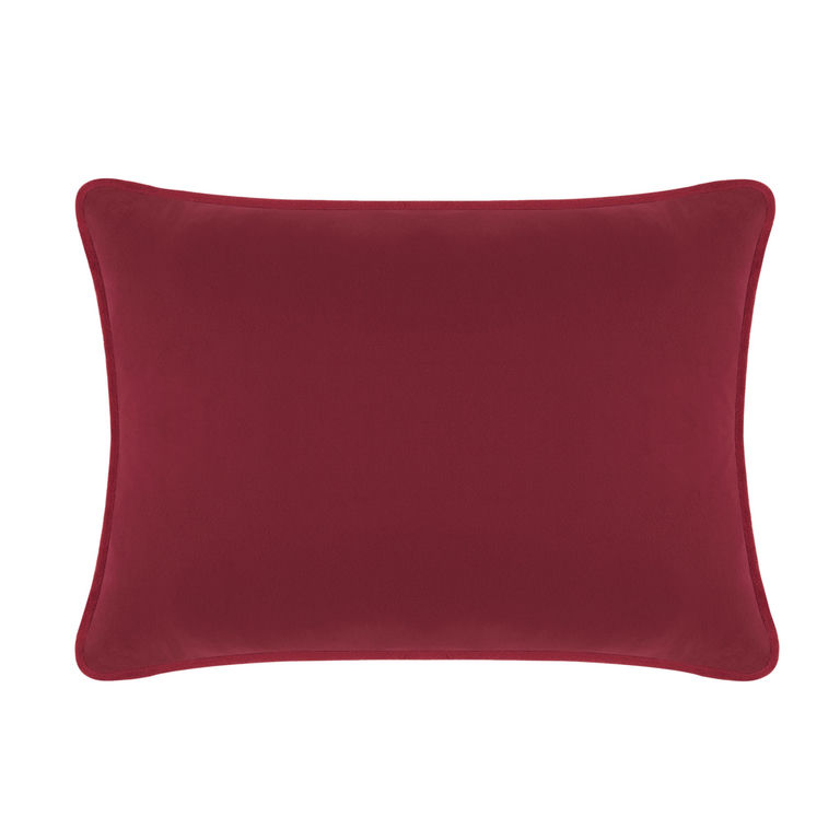 Burgundy velvet pillow with a smooth texture rectangular shape and rounded edges.
