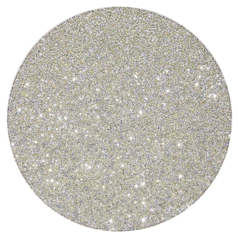 Round&#x20;placemat&#x20;with&#x20;a&#x20;shimmering&#x20;silver&#x20;rhinestone&#x20;surface&#x20;and&#x20;a&#x20;smooth&#x20;white&#x20;non-slip&#x20;backing&#x20;measuring&#x20;15&#x20;inches&#x20;in&#x20;diameter.