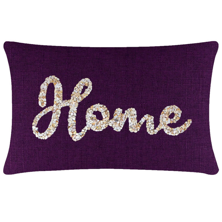 Rectangular pillow with a textured purple fabric featuring a seashell design spelling "Home" in beige and white tones.