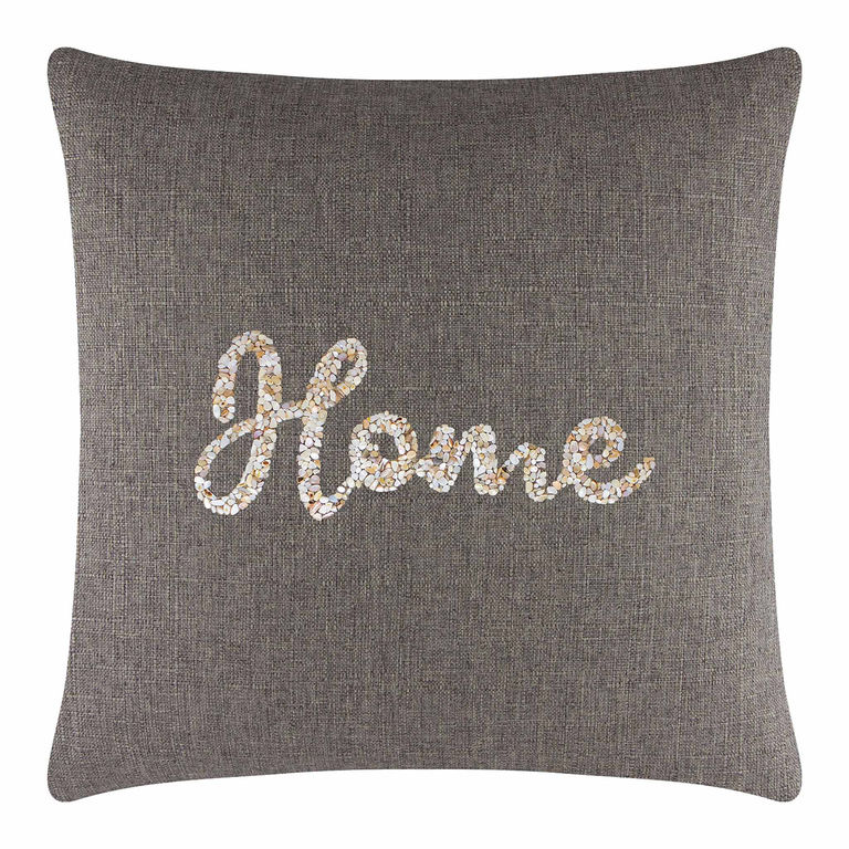 Square pillow in brown textured fabric with seashell "Home" design in cream gold and white embellishments.