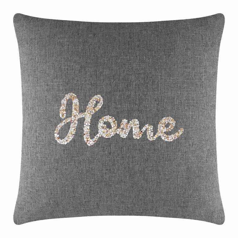 Gray&#x20;fabric&#x20;pillow&#x20;with&#x20;a&#x20;textured&#x20;surface&#x20;featuring&#x20;a&#x20;seashell&#x20;&quot;Home&quot;&#x20;design&#x20;in&#x20;cream&#x20;beige&#x20;and&#x20;light&#x20;brown&#x20;tones.