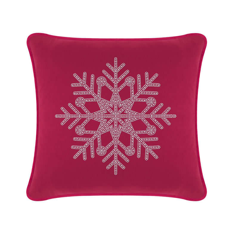 Fuchsia velvet pillow featuring a rhinestone snowflake design in the center with a smooth plush texture.