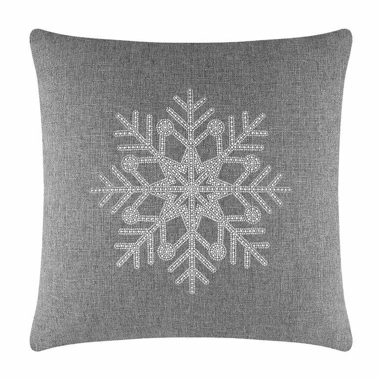 Gray square pillow featuring a rhinestone snowflake design on a textured fabric surface.