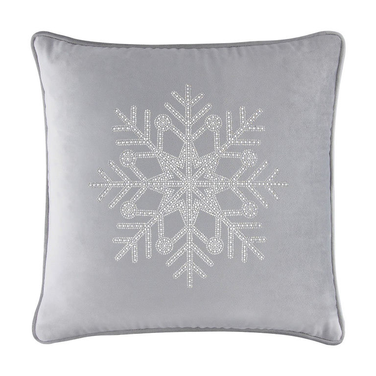Silver velvet pillow with a rhinestone snowflake design featuring a square shape and piped edges.