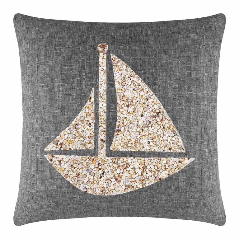 Gray pillow featuring a seashell sailboat design in beige and cream tones on a textured background.