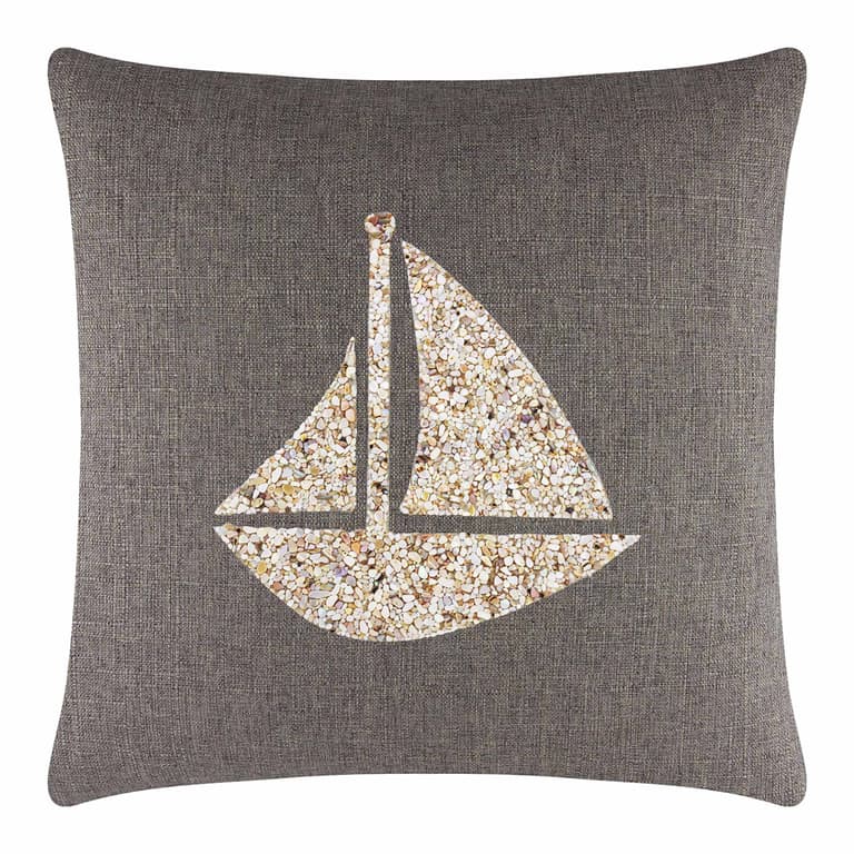 Square pillow with a dark gray textured fabric featuring a seashell sailboat design in beige and cream tones.