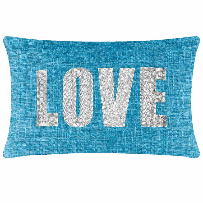 Aqua rectangular pillow with the word "LOVE" in rhinestones and faux pearls on a textured woven surface.