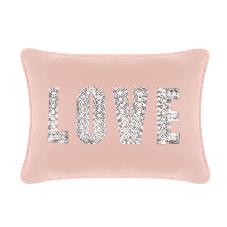 Blush velvet rectangular pillow with "LOVE" in rhinestones and faux pearls featuring a smooth texture and piped edges.