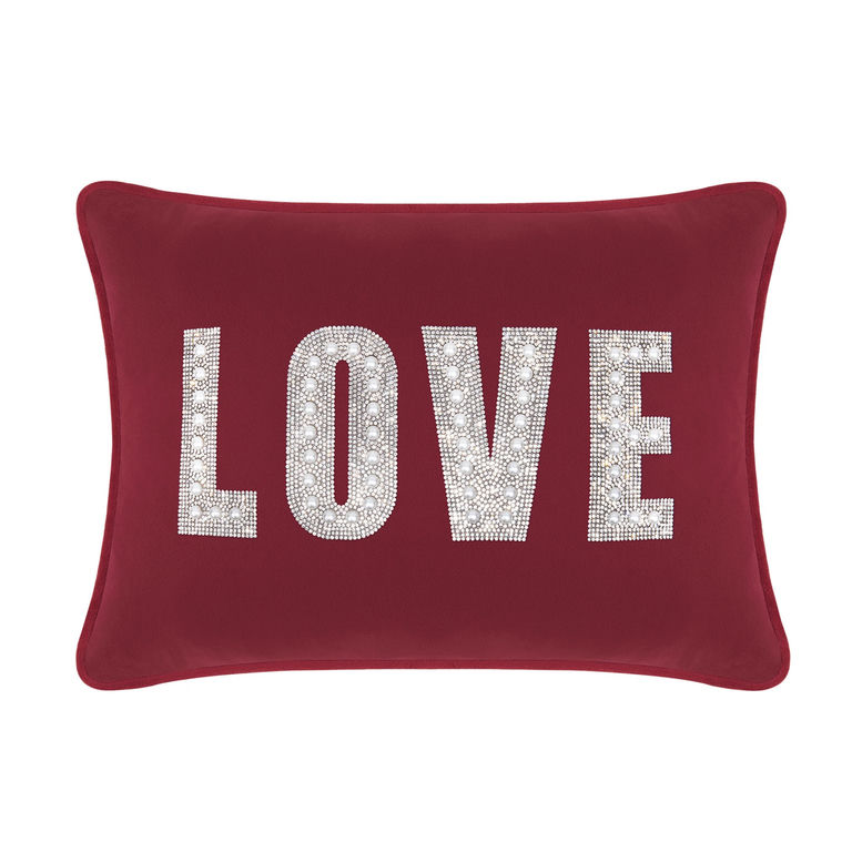 Burgundy velvet pillow with rhinestone and faux pearl embellishments spelling "LOVE" in large letters.