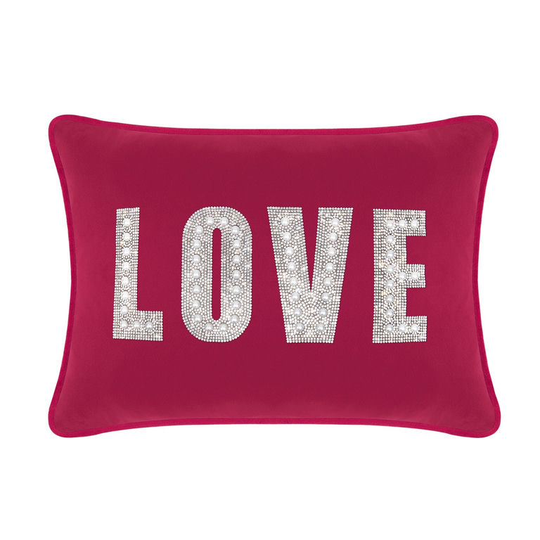 Fuchsia&#x20;velvet&#x20;pillow&#x20;with&#x20;rhinestone&#x20;and&#x20;faux&#x20;pearl&#x20;embellishments&#x20;spelling&#x20;&quot;LOVE&quot;&#x20;in&#x20;large&#x20;letters.