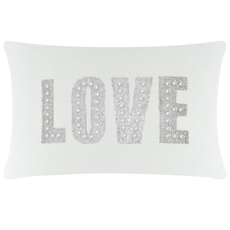 White&#x20;rectangular&#x20;pillow&#x20;featuring&#x20;the&#x20;word&#x20;&quot;LOVE&quot;&#x20;embellished&#x20;with&#x20;rhinestones&#x20;and&#x20;faux&#x20;pearls&#x20;on&#x20;a&#x20;textured&#x20;surface.