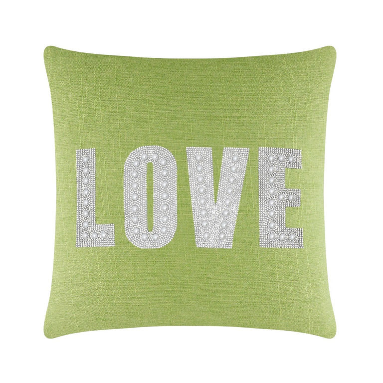 Lime green square pillow with the word "LOVE" in rhinestones and faux pearls on a textured fabric surface.