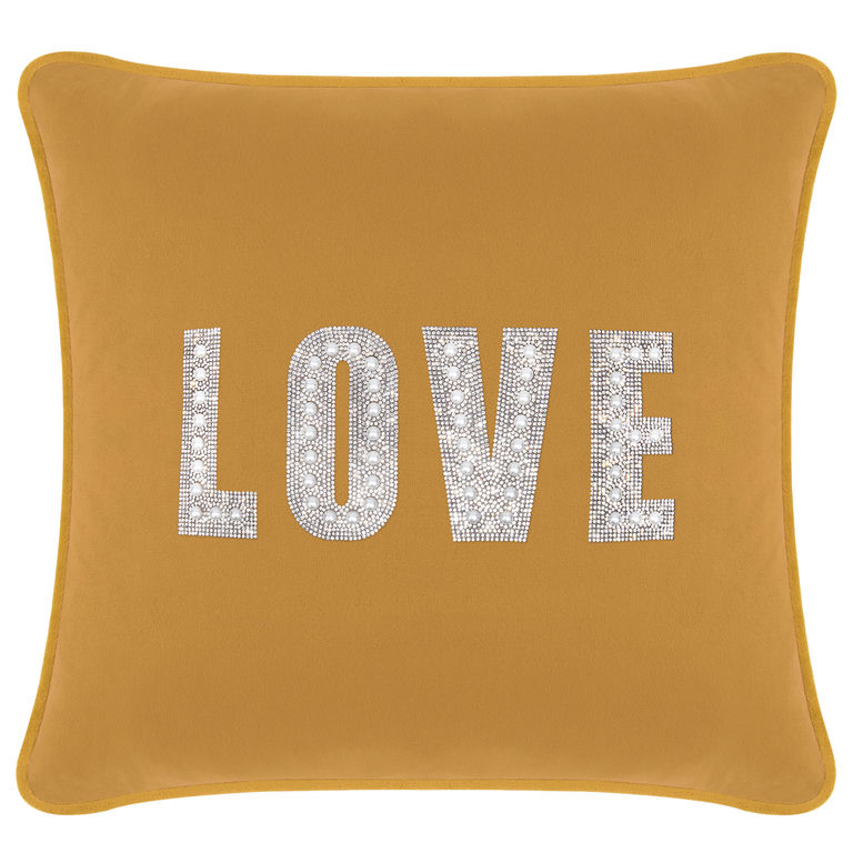 Gold&#x20;velvet&#x20;pillow&#x20;featuring&#x20;the&#x20;word&#x20;&quot;LOVE&quot;&#x20;in&#x20;rhinestones&#x20;and&#x20;faux&#x20;pearls&#x20;on&#x20;a&#x20;smooth&#x20;surface.