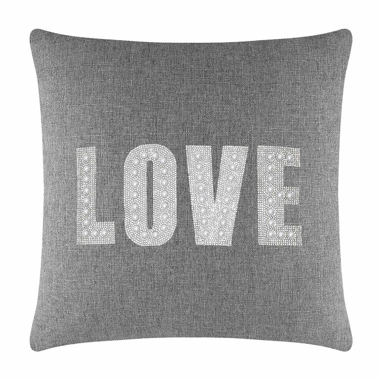 Gray woven pillow featuring the word "LOVE" in rhinestones and faux pearls with a plush texture and square shape.
