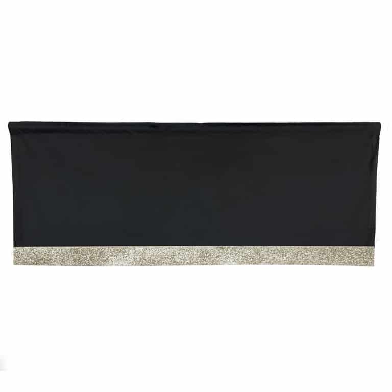 Black velvet valance with a silver rhinestone trim along the bottom edge rectangular shape smooth texture.