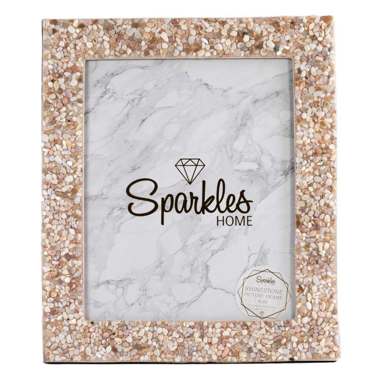 A square picture frame with a sandy beige border made of small seashells and glass beads featuring a marble-patterned inner background.