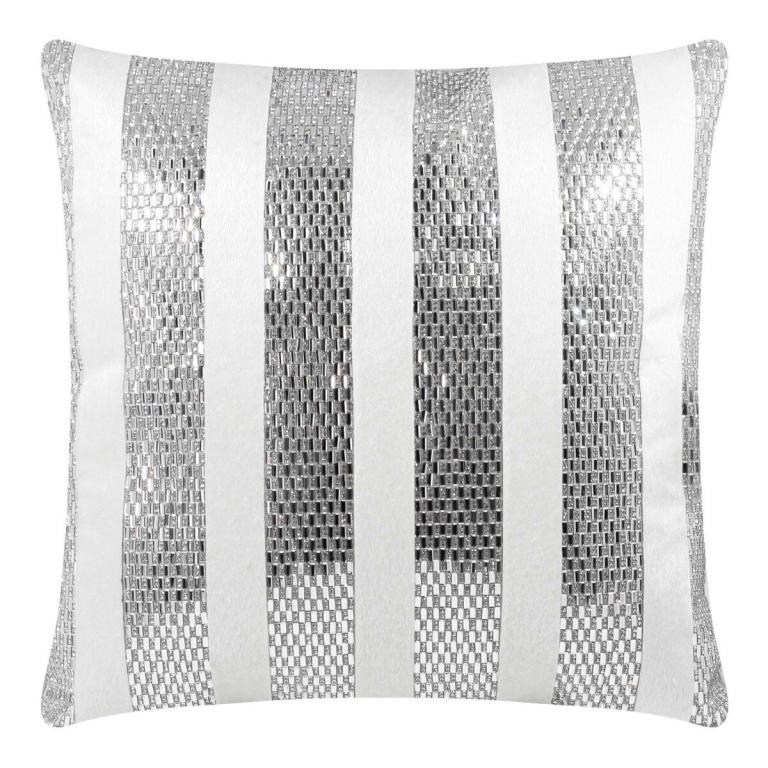 Square pillow with silver rhinestone stripes on a white velvet background featuring a smooth texture and a plush appearance.