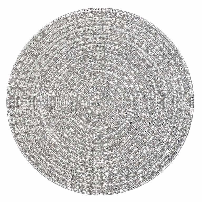 Round silver placemat featuring intricate patterns of glass rhinestones arranged in concentric circles.