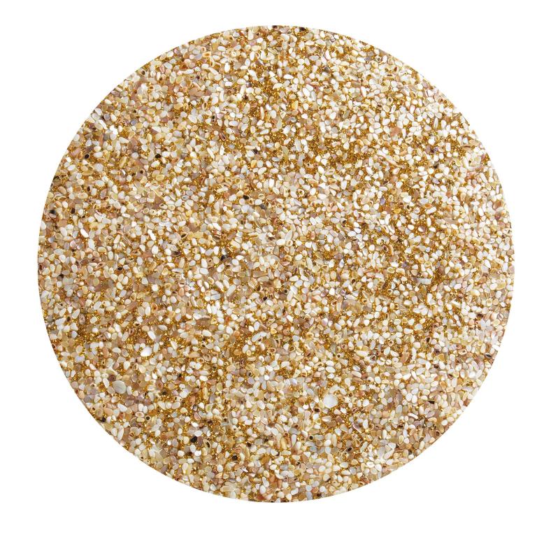 Round tan placemat with a textured surface featuring small shells and golden rhinestones embedded throughout.
