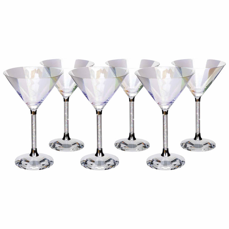 A clear iridescent martini glass with a crystal-filled stem and a faceted base reflecting light in various colors.