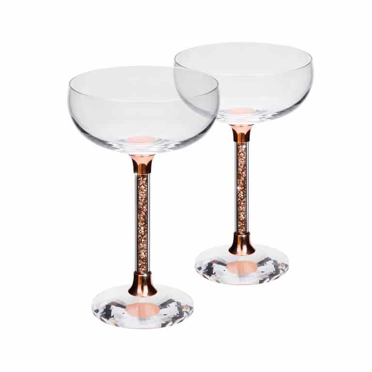Pair of rose coupe glasses with crystal-filled stems and faceted bases
