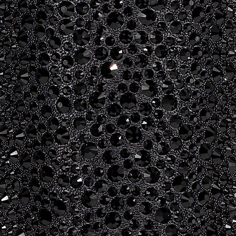 Black&#x20;fabric&#x20;with&#x20;various&#x20;sizes&#x20;of&#x20;black&#x20;rhinestones&#x20;featuring&#x20;a&#x20;glossy&#x20;surface&#x20;and&#x20;intricate&#x20;arrangement&#x20;of&#x20;sparkling&#x20;facets.