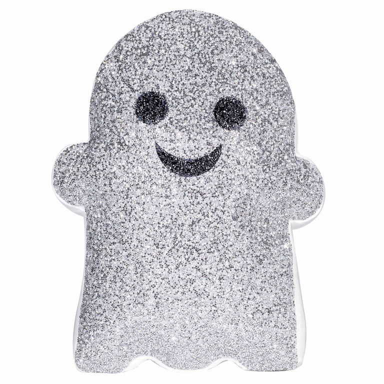 Silver&#x20;glitter&#x20;ghost-shaped&#x20;pillow&#x20;with&#x20;black&#x20;eyes&#x20;and&#x20;a&#x20;smiling&#x20;mouth&#x20;featuring&#x20;a&#x20;plush&#x20;texture&#x20;and&#x20;a&#x20;white&#x20;border.
