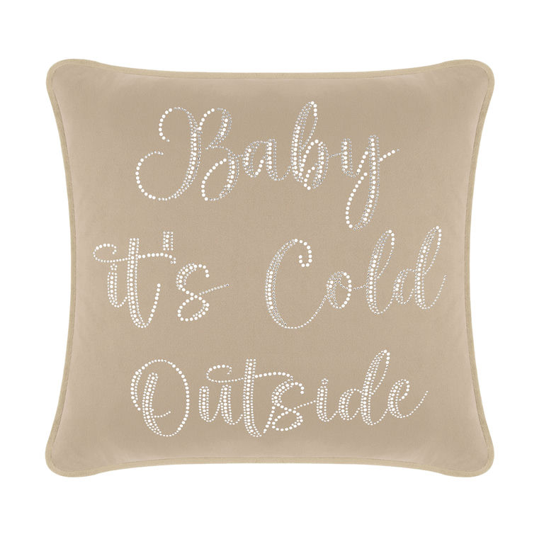 Taupe velvet pillow with white glass rhinestones spelling "Baby it's Cold Outside" on a soft plush surface.