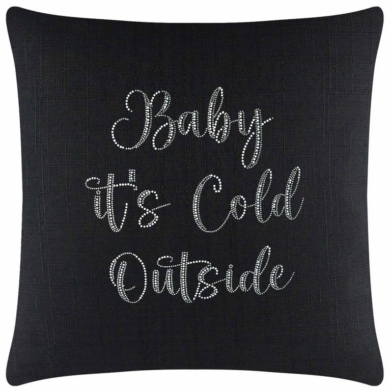Black textured pillow featuring white glass rhinestones spelling "Baby it's Cold Outside" in cursive and print.