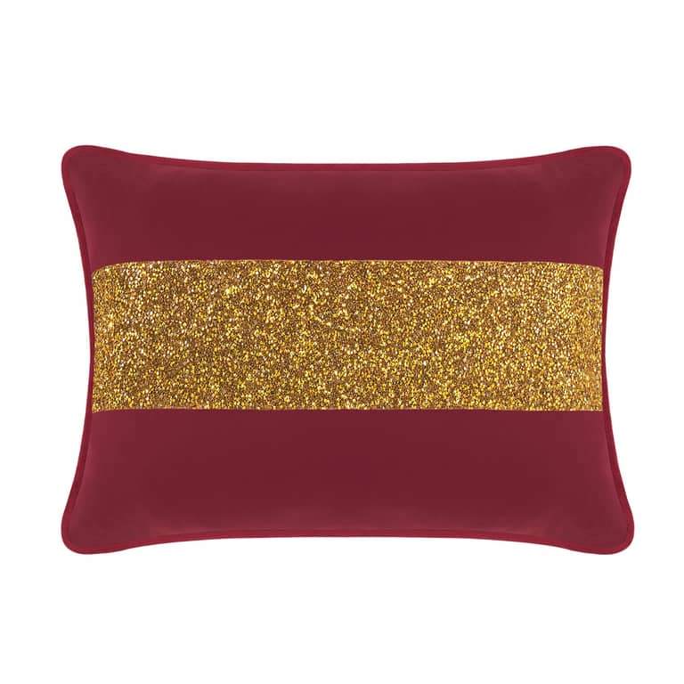 Burgundy velvet pillow with a gold glitter stripe rectangular shape and a smooth texture.