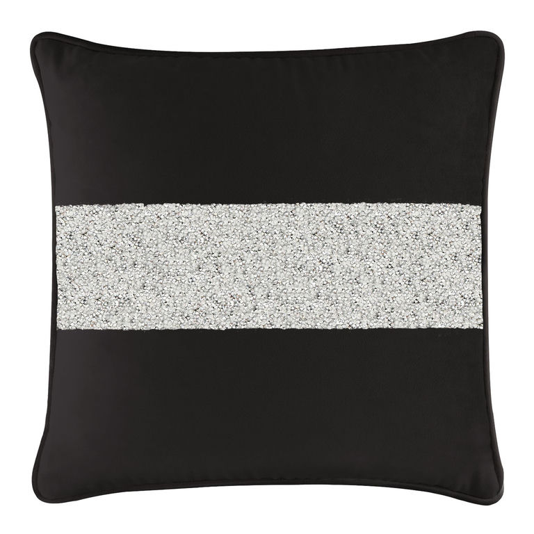 Black velvet pillow with a horizontal silver rhinestone stripe square shape soft texture and piped edges.