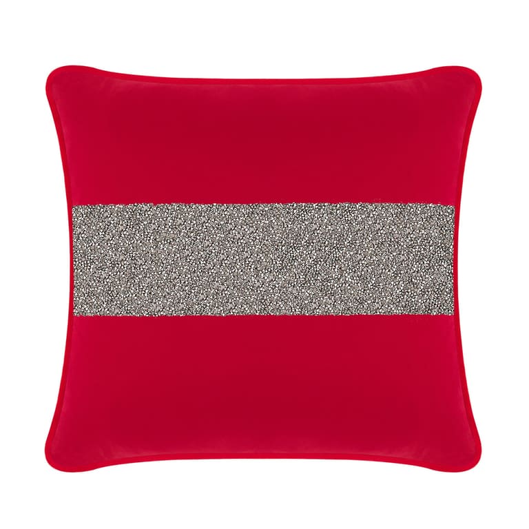 Red velvet pillow featuring a wide silver rhinestone stripe across the center with a smooth texture and piped edges.