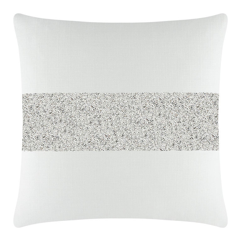 White pillow with a woven texture featuring a silver rhinestone stripe across the center.