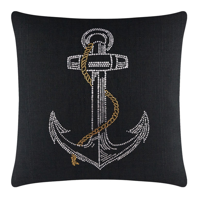 Black square pillow featuring a rhinestone anchor design with silver white and gold embellishments on a textured surface.