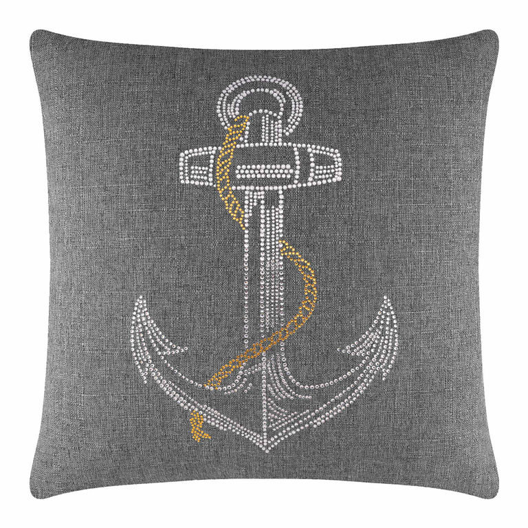 Gray pillow featuring a rhinestone anchor design with a gold chain embellishment on a textured fabric surface.