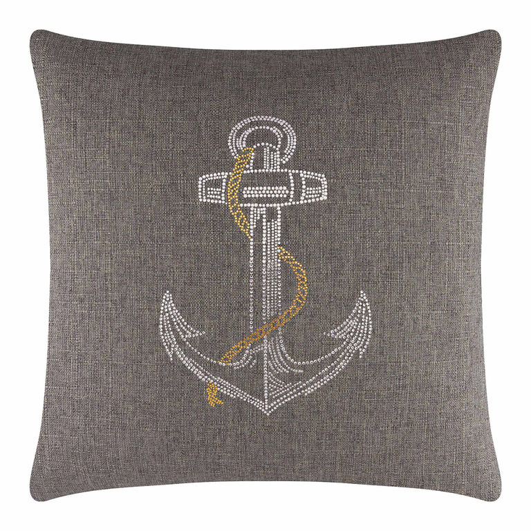 Square brown pillow with a textured fabric featuring a rhinestone anchor design in silver and gold embellishments.