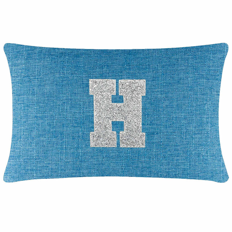 Aqua rectangular pillow with a textured fabric and a glittering silver rhinestone letter "H" in the center.