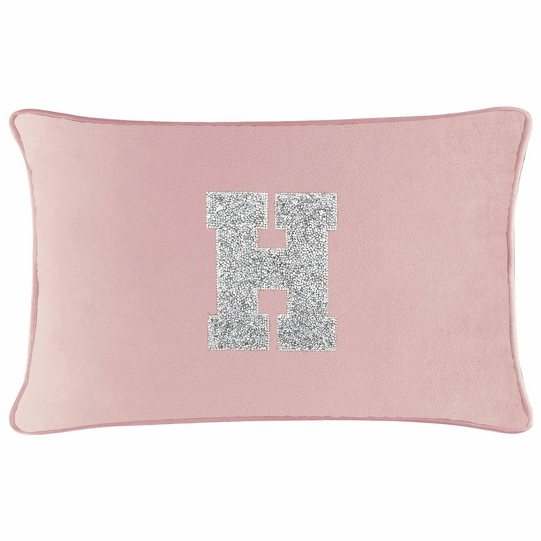 Blush velvet pillow with a silver rhinestone monogram letter "H" on a soft rectangular shape.