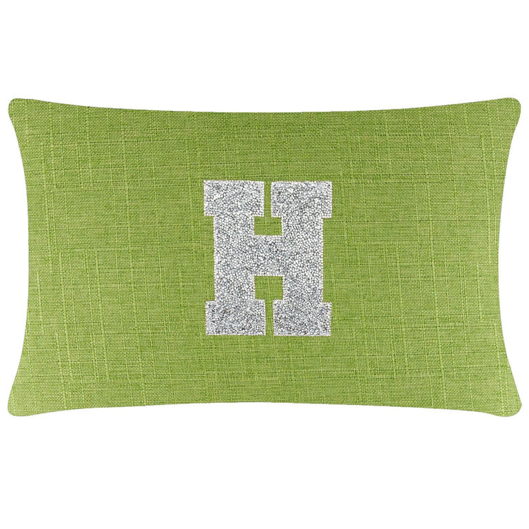 Rectangular lime green pillow with a textured fabric and a silver rhinestone letter "H" in the center.