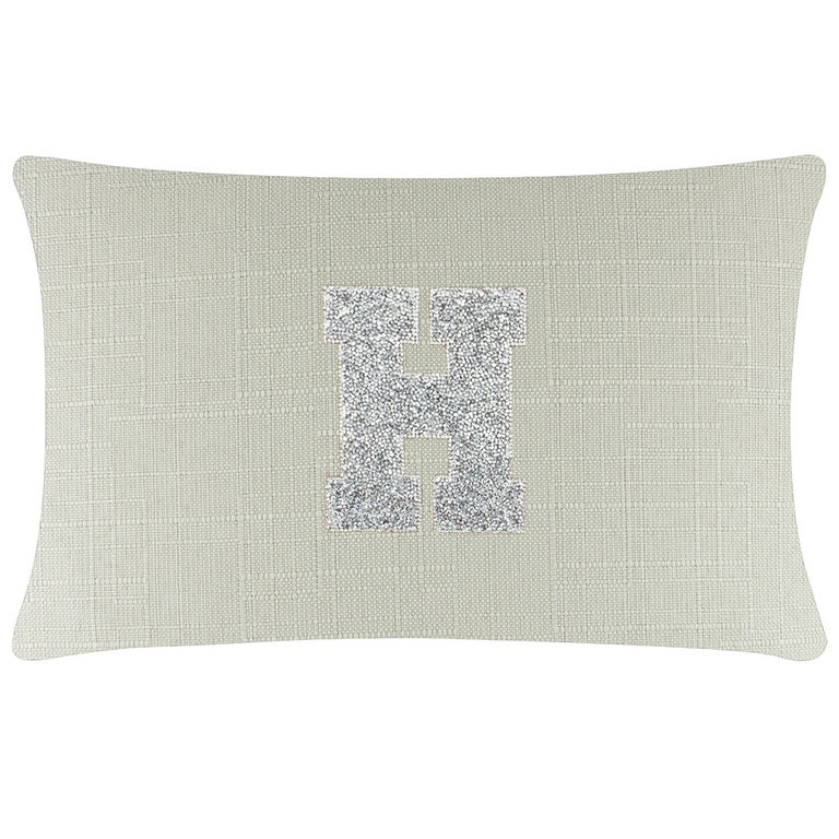 Rectangular light gray linen pillow with a textured surface and a silver rhinestone monogram letter "H" in the center.